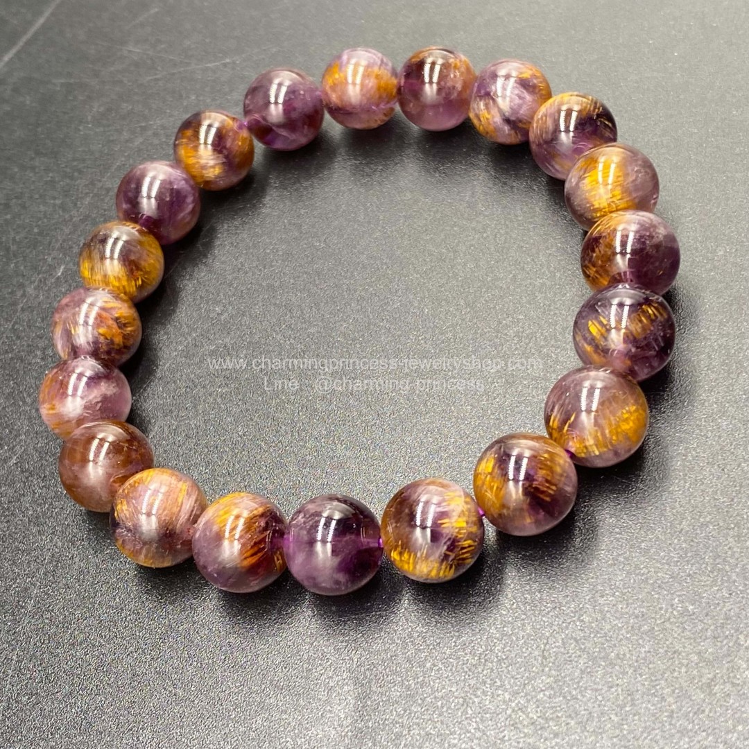 Cacoxenite in Amethsyt AAA คาค็อกซิไนท์ในอเมทิสต์ 9.5 มม ภายในมีแร่สีทองระยิบระยับเสริมอำนาจบารมีความมั่งคั่งร่ำรวย สวยน่าใส่มากๆค่ะ