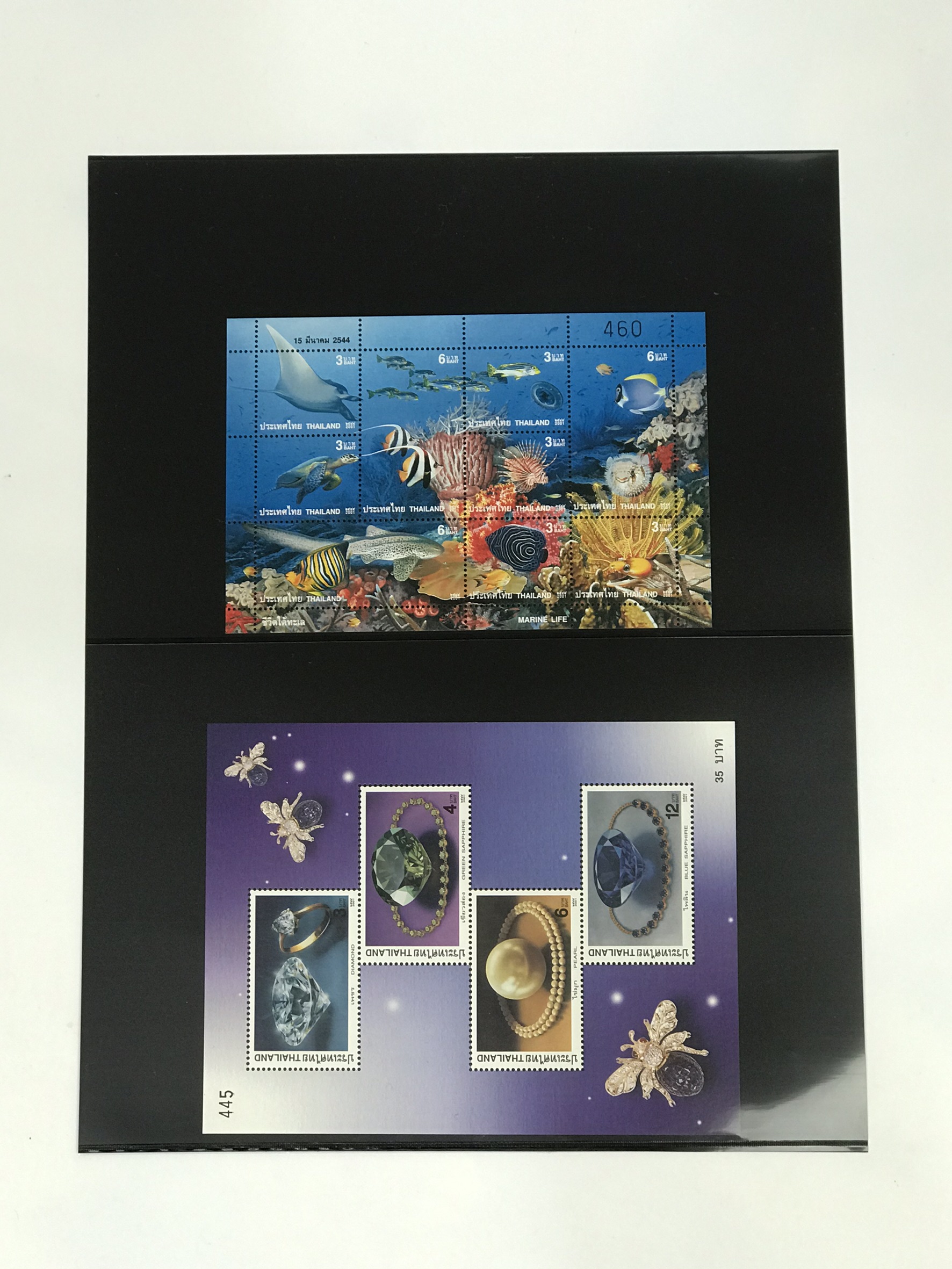 เมาท์แสตมป์เนื้อเซลลูลอย์สีดำเป็นห่อ (มี 7 แบบ 1-7 ช่อง ทั้งห่อมีแบบเดียวห่อละ 10 แผ่น)