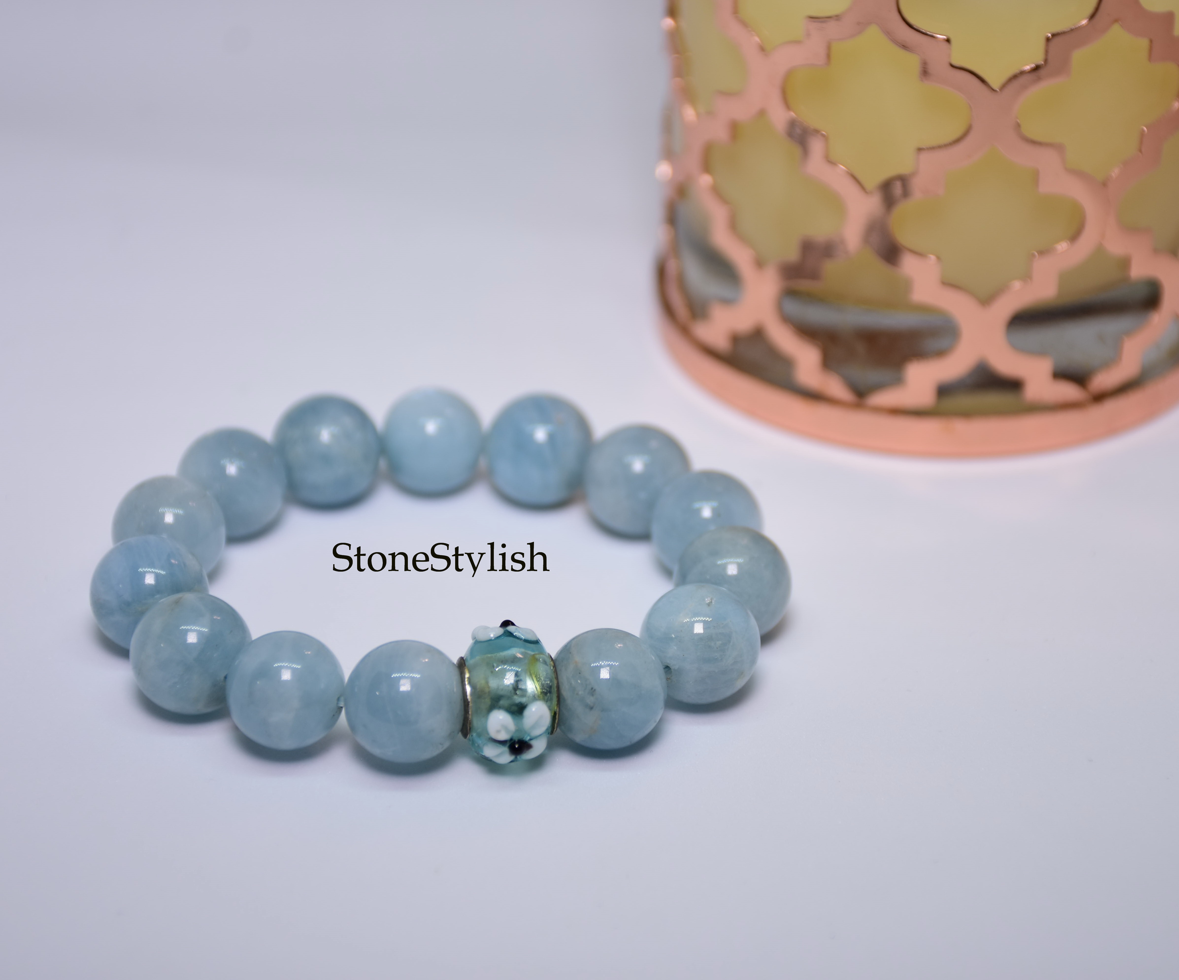 สร้อยข้อมือ อความารีน (Aquamarine) เกรด AAA ขนาด 10 มิล แต่งหัวลูกปัดดอกไม้สีฟ้า