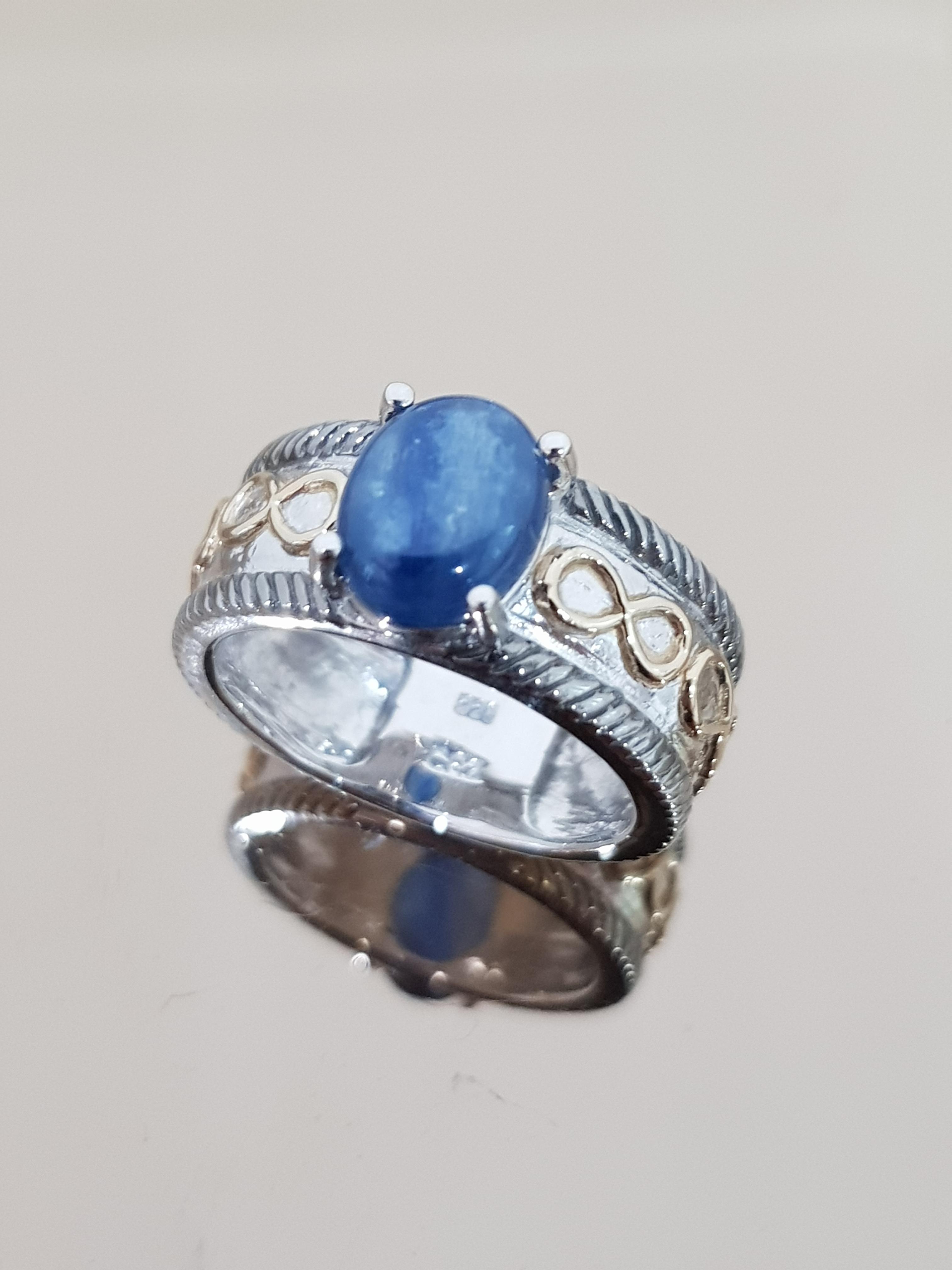 แหวนไคยาไนท์ เม็ดเดี่ยว พลอยสีน้ำเงิน ลาย อินฟินิตี้ 925 Kyanite Solitaire Oval Antique Infinity Shrank Design Oval 10x8 mm Band Ring