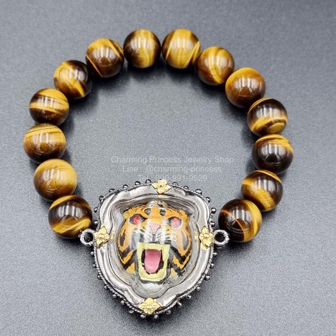 พญาเสือ รุ่นบูชาครู วัดบางพระ หลวงพ่อเปิ่น พ.ศ. 2554 เสริมอำนาจบารมี โชคลาภ เสริมหน้าที่การงาน ก้าวหน้ายิ่งใหญ่ดุจดั่งพญาเสือ แคล้วคลาด แก้ดวงตก แก้ปีชง ร้อยพร้อมไทเกอร์อาย หินตาเสือ 12 มม