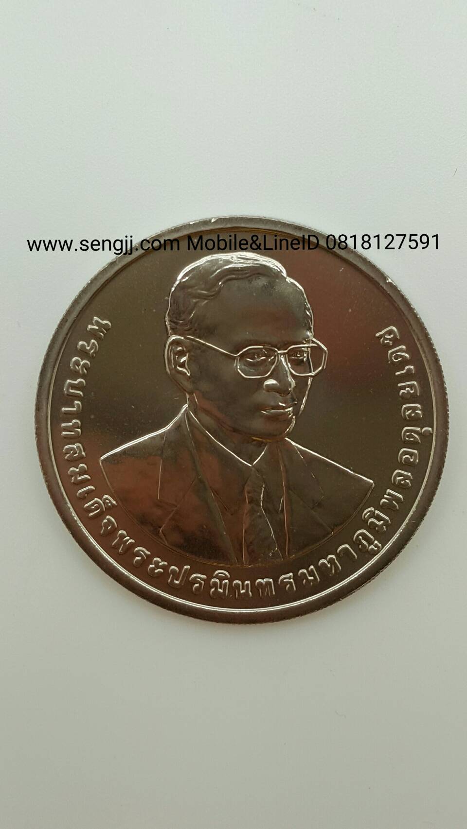 เหรียญกษาปณ์นิเกิล 100 บาท ที่ระลึก 100 ปี กรมสรรพากร พ.ศ.2558