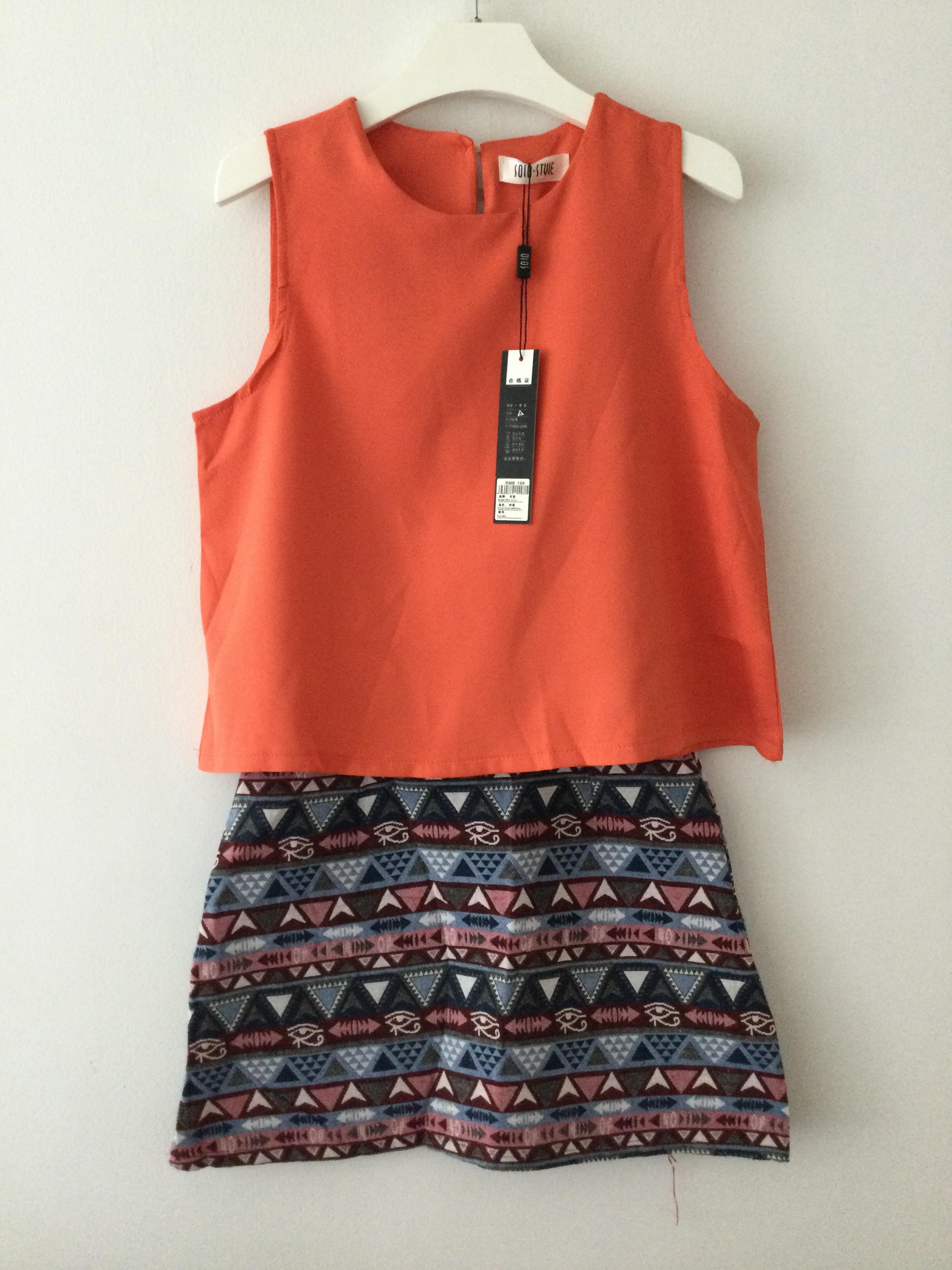 ชุดเซตเสื้อแขนกุดสีส้มมาพร้อมกระโปรงผ้าทอลายโบฮีเมียนทรงเอ