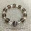 Smoky Quartz and Crystal Quartz สโม๊กกี้ ควอทซ์ สร้างพลังแห่งความรักให้คู่รัก และ คริสตัลควอตซ์ เป็นสัญลักษณ์ของความคิดจิตใจและจิตวิญญาณอันบริสุทธิ์ ประดับลูกบอลอินเดีย