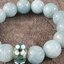 สร้อยข้อมือ อความารีน (Aquamarine) เกรด AAA ขนาด 10 มิล แต่งหัวลูกปัดดอกไม้สีฟ้า