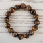 Tiger Eye ไทเกอร์อาย 10 มม ปกป้องคุ้มครอง มักจะเป็นผู้ชนะในการแข่งขัน และผู้ที่ดวงตกอยากหนุนดวงให้ดีขึ้น